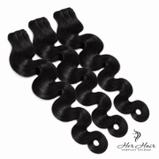 Three bundles of Burmese Raw Body Wave hair from Her Hair Company, showing the soft, natural wave texture and bundle packaging.