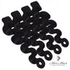 Four bundles of Burmese raw body wave hair from Her Hair Company, shown in a standard bundle packaging.