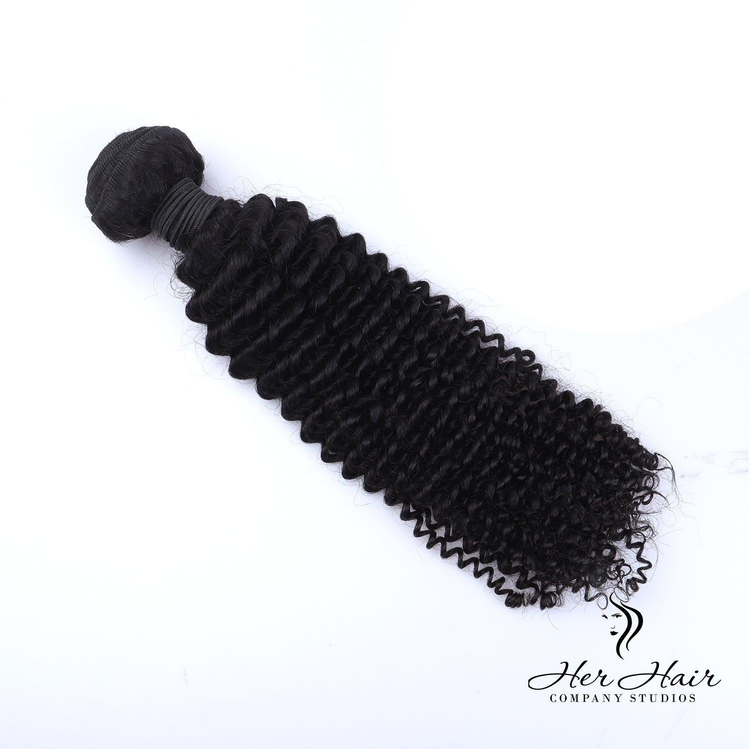 Brazilian kinky curly hair bundle from Her Hair Company, natural textured curly hair extension, close-up of the kinky curls.