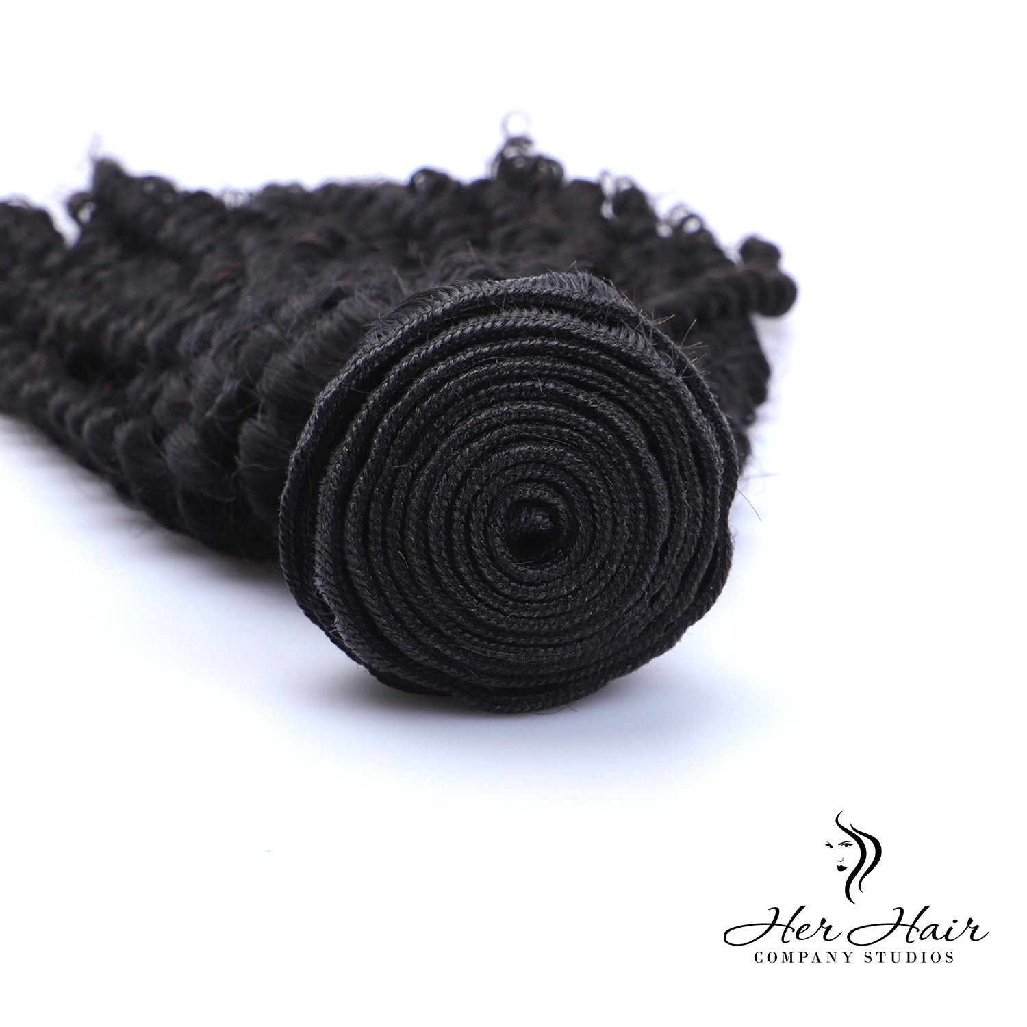 Brazilian kinky curly hair bundle from Her Hair Company, showing thick, natural curls in a standard 1-bundle hair extension.