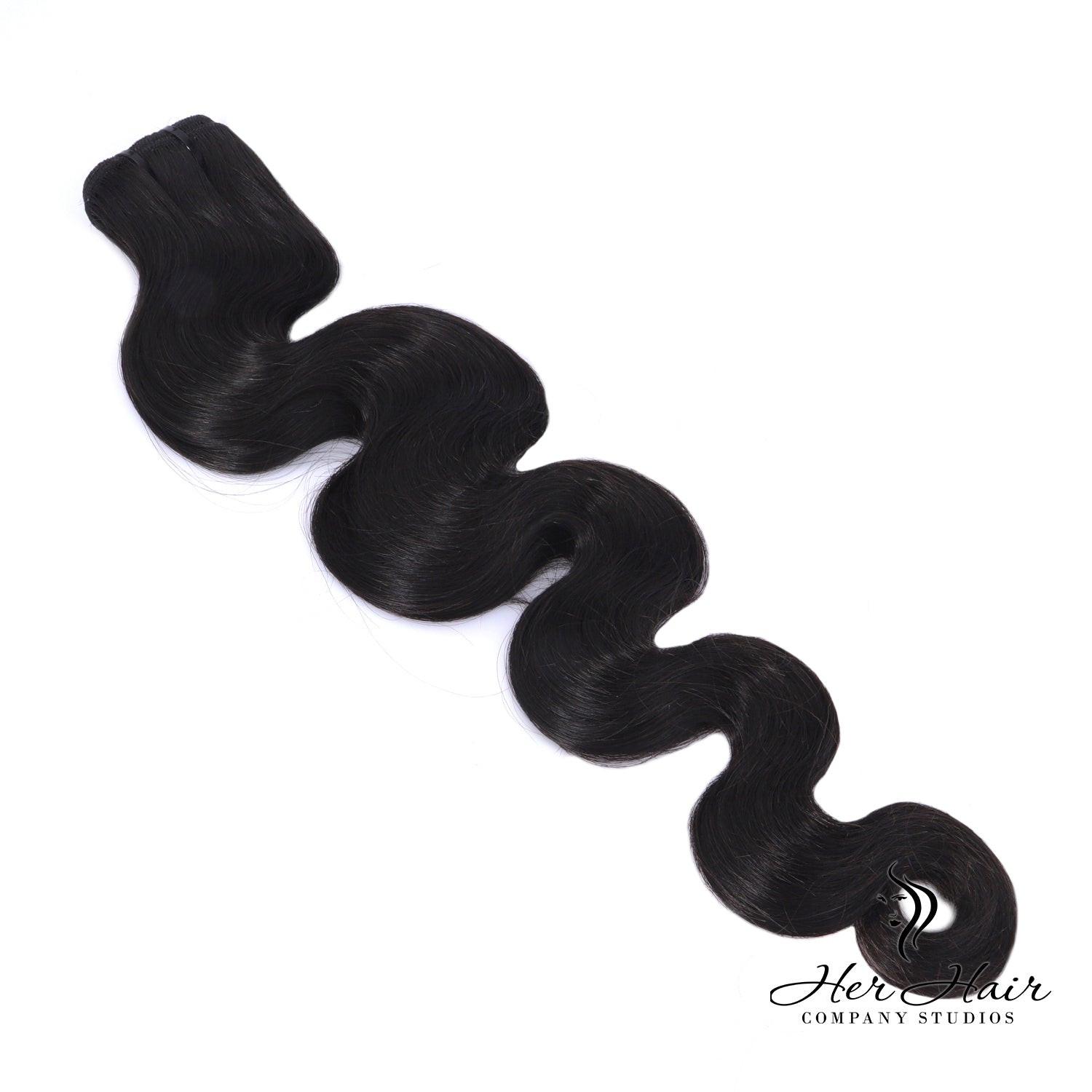 Burmese Raw Body Wave Hair bundle by Her Hair Company, showing natural, soft, straight hair with a smooth, shiny texture.