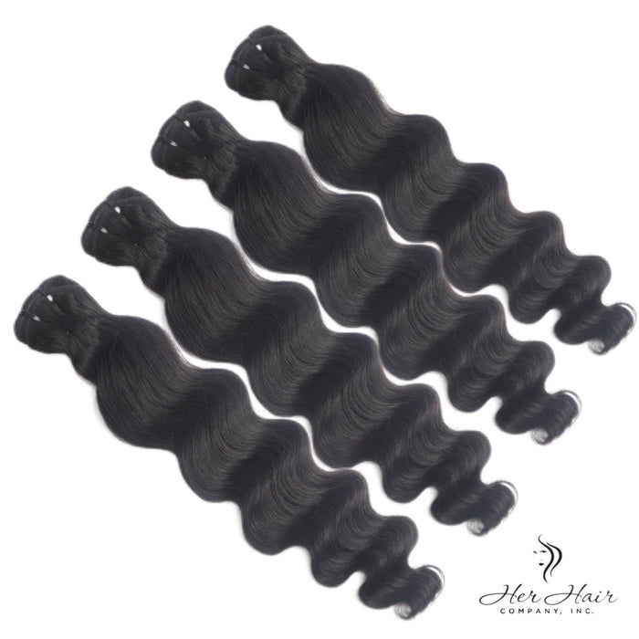 Four bundles of Burmese raw loose deep wave hair from Her Hair Company, showing natural wavy texture and bundle arrangement.