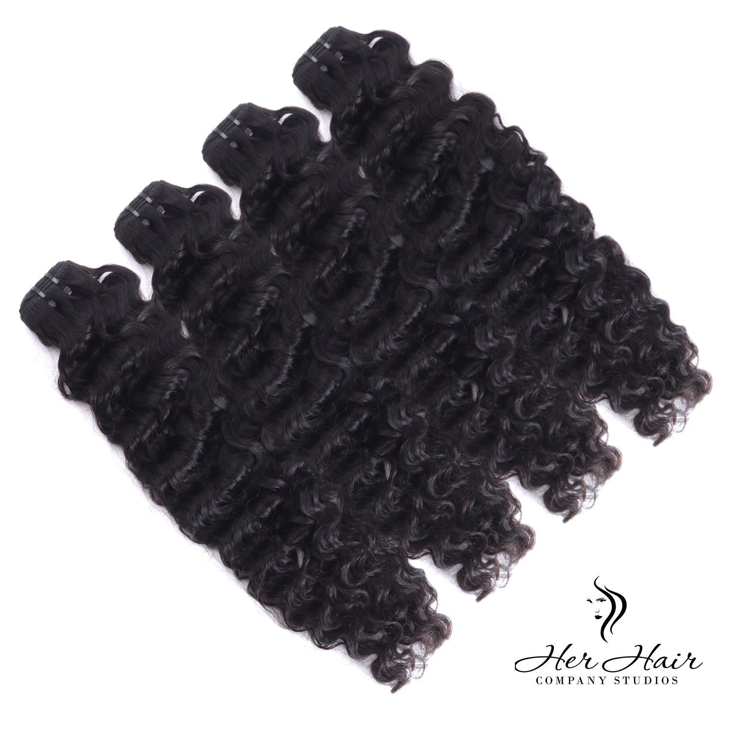 Burmese raw wavy hair bundles from Her Hair Company, showing four natural wavy hair bundles in a standard bundle deal.