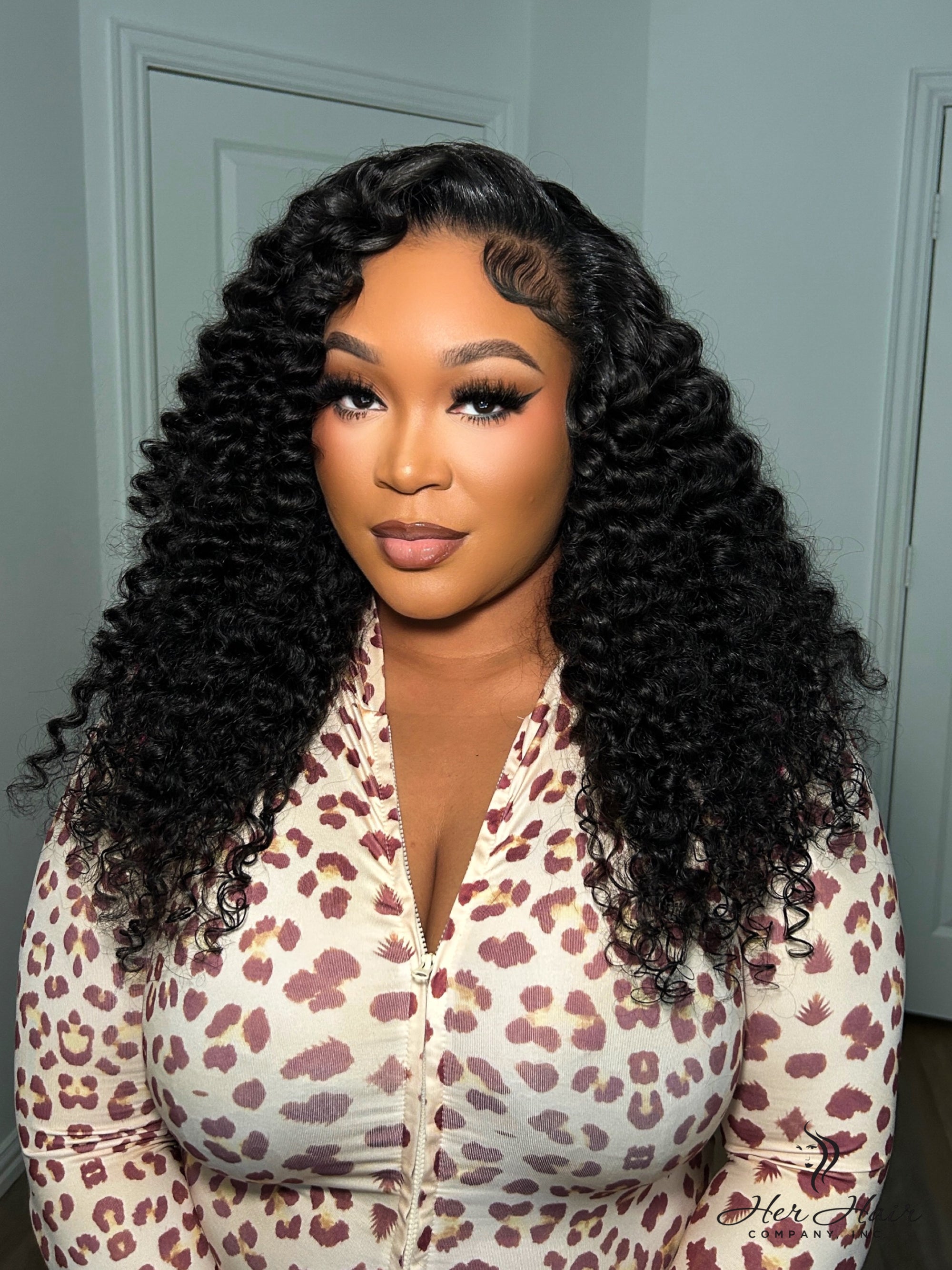 Brazilian Water Wave hair bundle from Her Hair Company showing soft, wavy hair texture in a standard bundle.