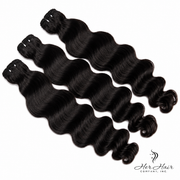 Three bundles of Burmese Raw Loose Deep Wave Hair by Her Hair Company, showing the textured, wavy hair extensions.