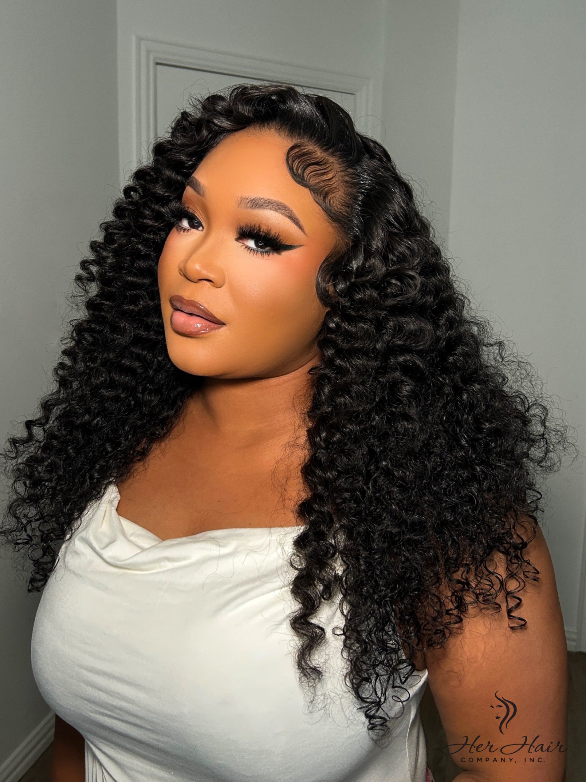 Brazilian water wave hair bundle from Her Hair Company, showing soft, wavy natural hair texture in a standard bundle.