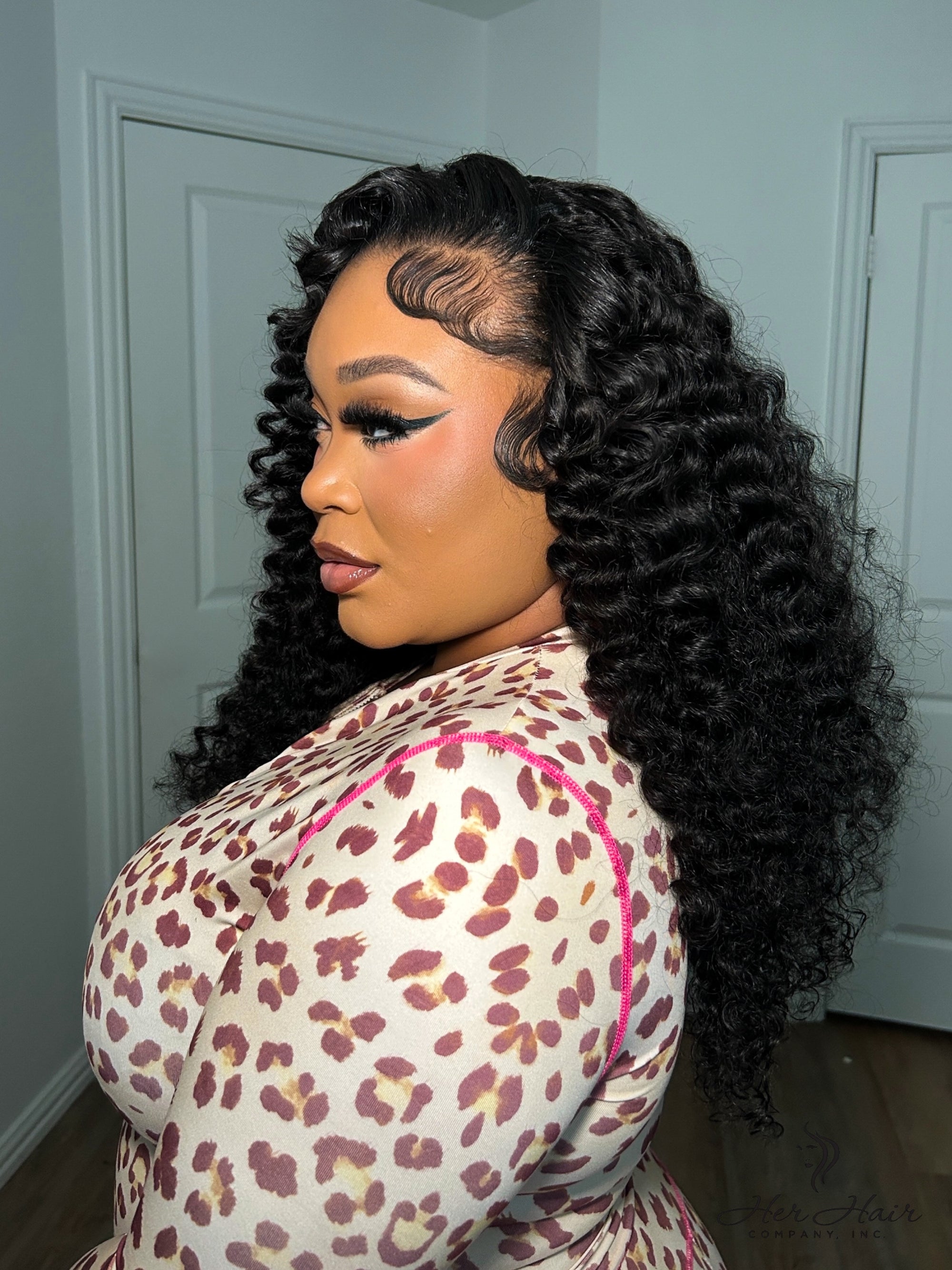 Brazilian Water Wave hair bundle from Her Hair Company showing lush, wavy natural hair with a standard bundle style.