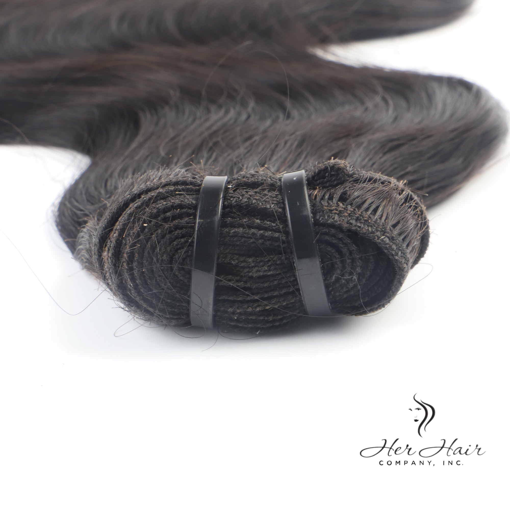Her Hair Company Brazilian Double Drawn Hair bundle showing thick, straight hair with natural shine and full length.