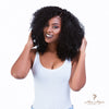 Brazilian kinky curly 4x4 HD lace closure from Her Hair Company, showing natural hair texture and lace front for seamless styling.