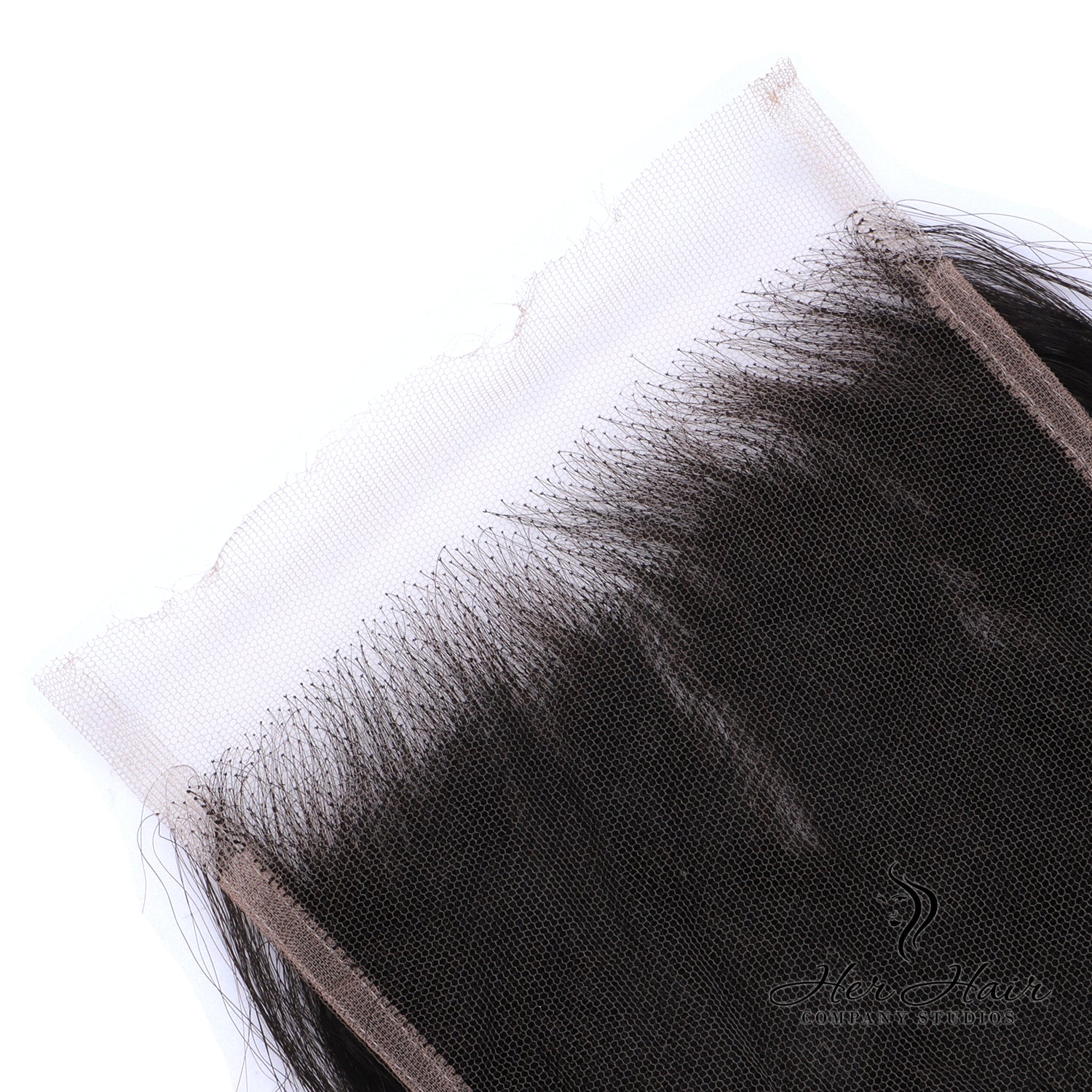 Brazilian raw wavy 5x5 HD lace closure from Her Hair Company, showing close-up of textured, natural wave pattern and lace detail.