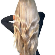 Three bundles of straight Brazilian 613# hair from Vendor Unknown, showing the lightweight, smooth, and shiny hair texture.