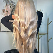 Four bundles of straight Brazilian 613# hair, showing the sleek, blonde bundles from the vendor-unknown standard bundle collection.