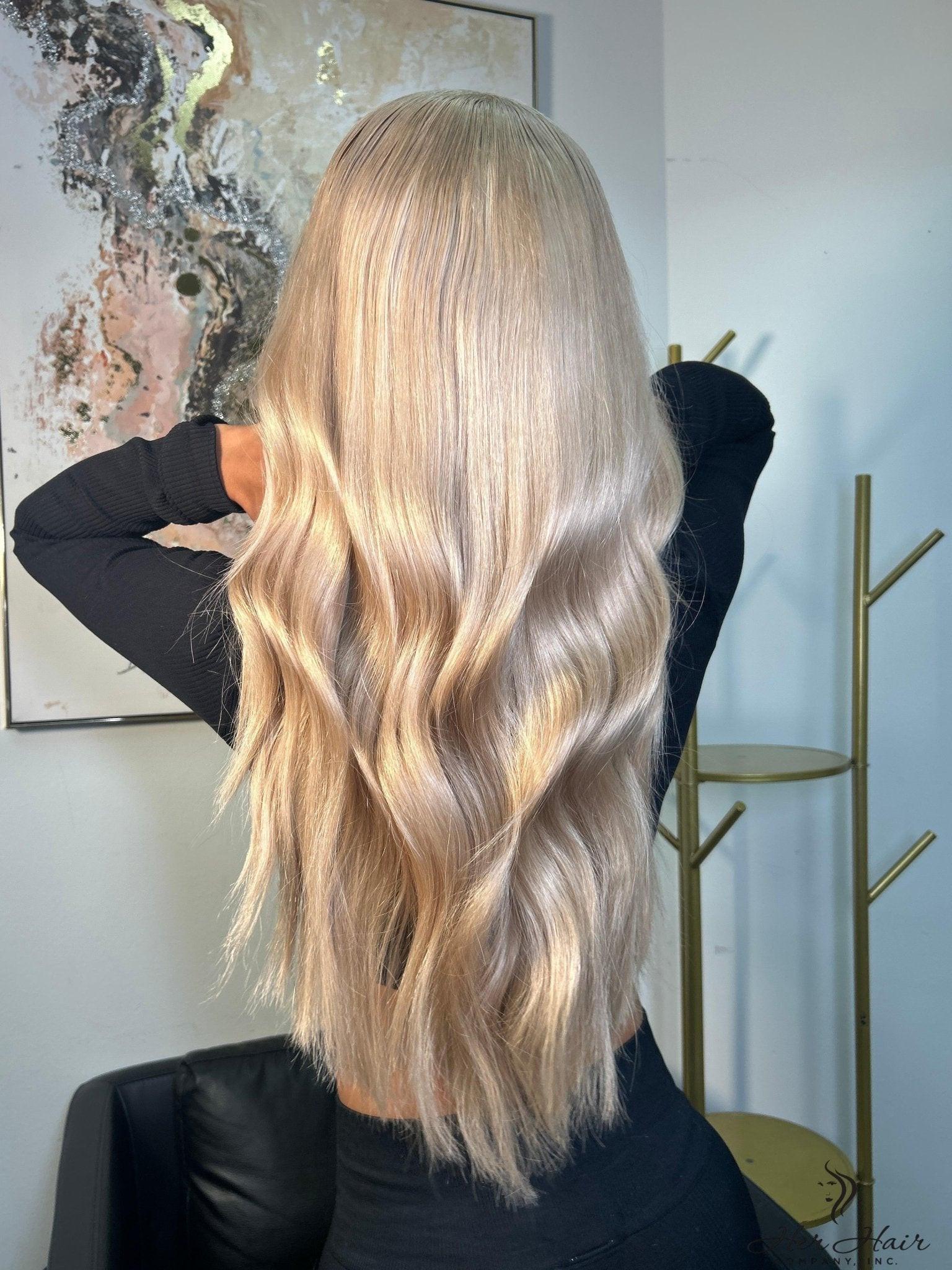 Four bundles of Brazilian 613# virgin hair in a standard bundle deal, showcasing light blonde hair extensions.