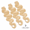Three bundles of straight Eurasian 613# hair from Vendor-Unknown, showcasing the hair's color, length, and texture.