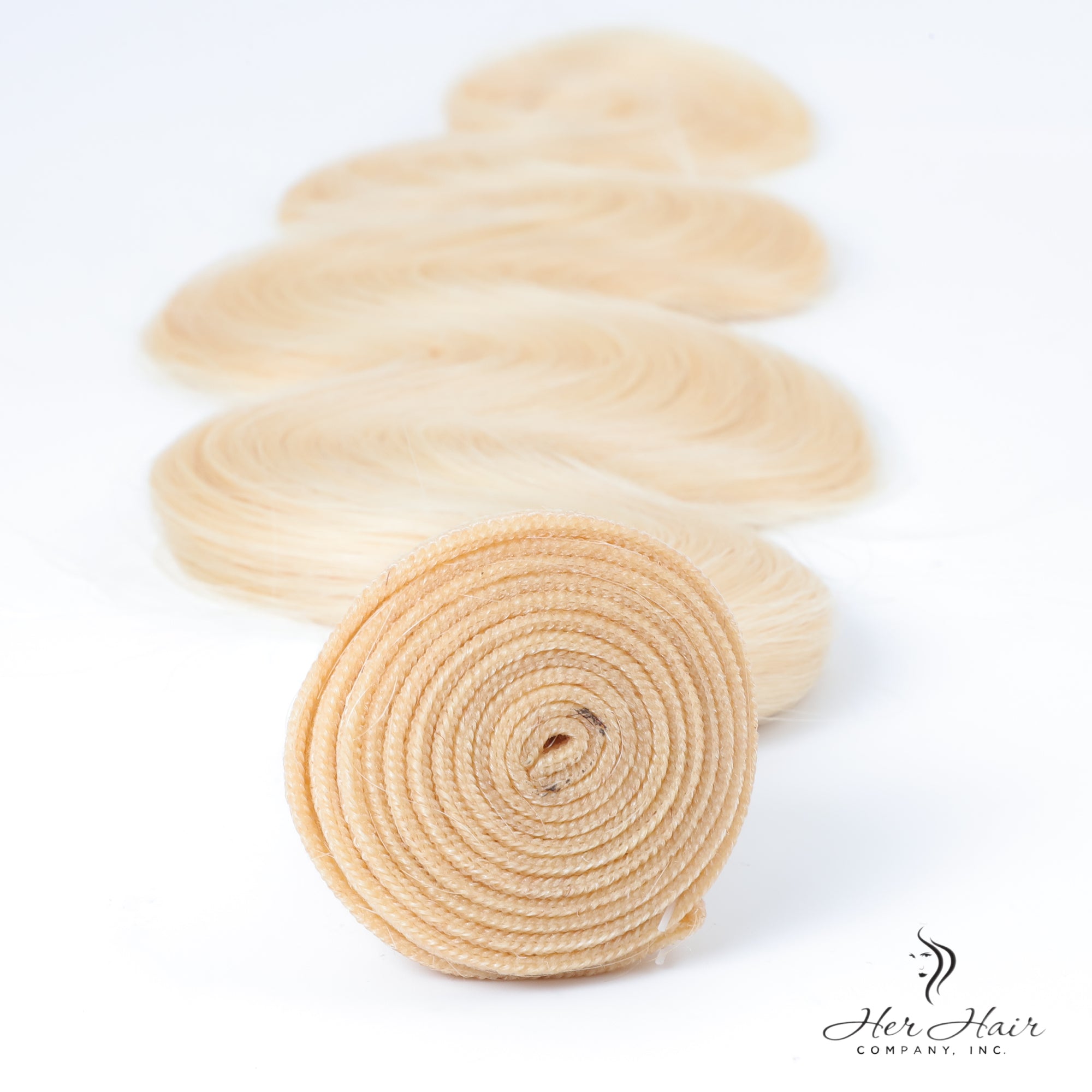 Brazilian 613# hair bundle, natural blonde straight weave, vendor-unknown, showing smooth, shiny hair extension bundle.