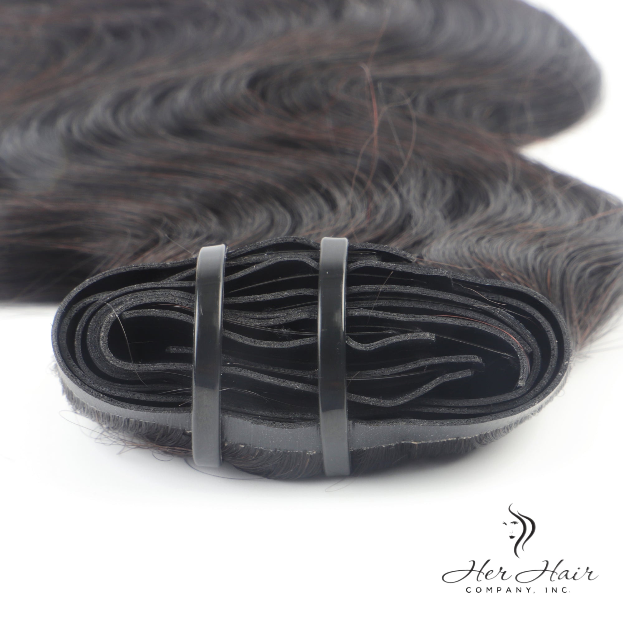 Brazilian clip-in hair extensions in a standard bundle, featuring natural, straight Brazilian hair with clip-in attachments.