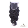 Brazilian wavy HD lace closure by Her Hair Company, showcasing natural waves and detailed lace front for seamless hairline.